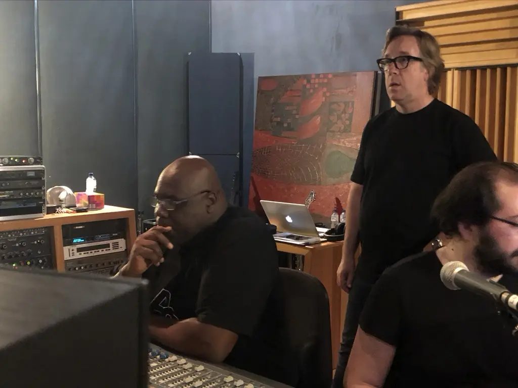 Artists and producers gathered during a professional studio session